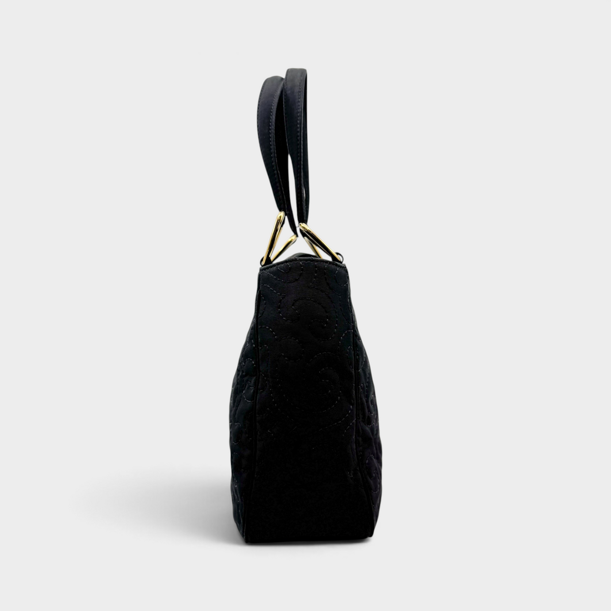 Studio61 Preloved Boutique Sydney vintage Yves Saint Laurent black quilted fabric evening bag, side profile view.