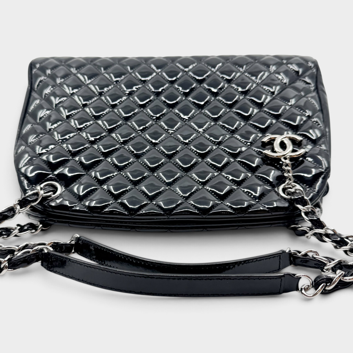 Studio61 Preloved Boutique Sydney Chanel black quilted patent leather Just Mademoiselle bowling bag with silver hardware.
