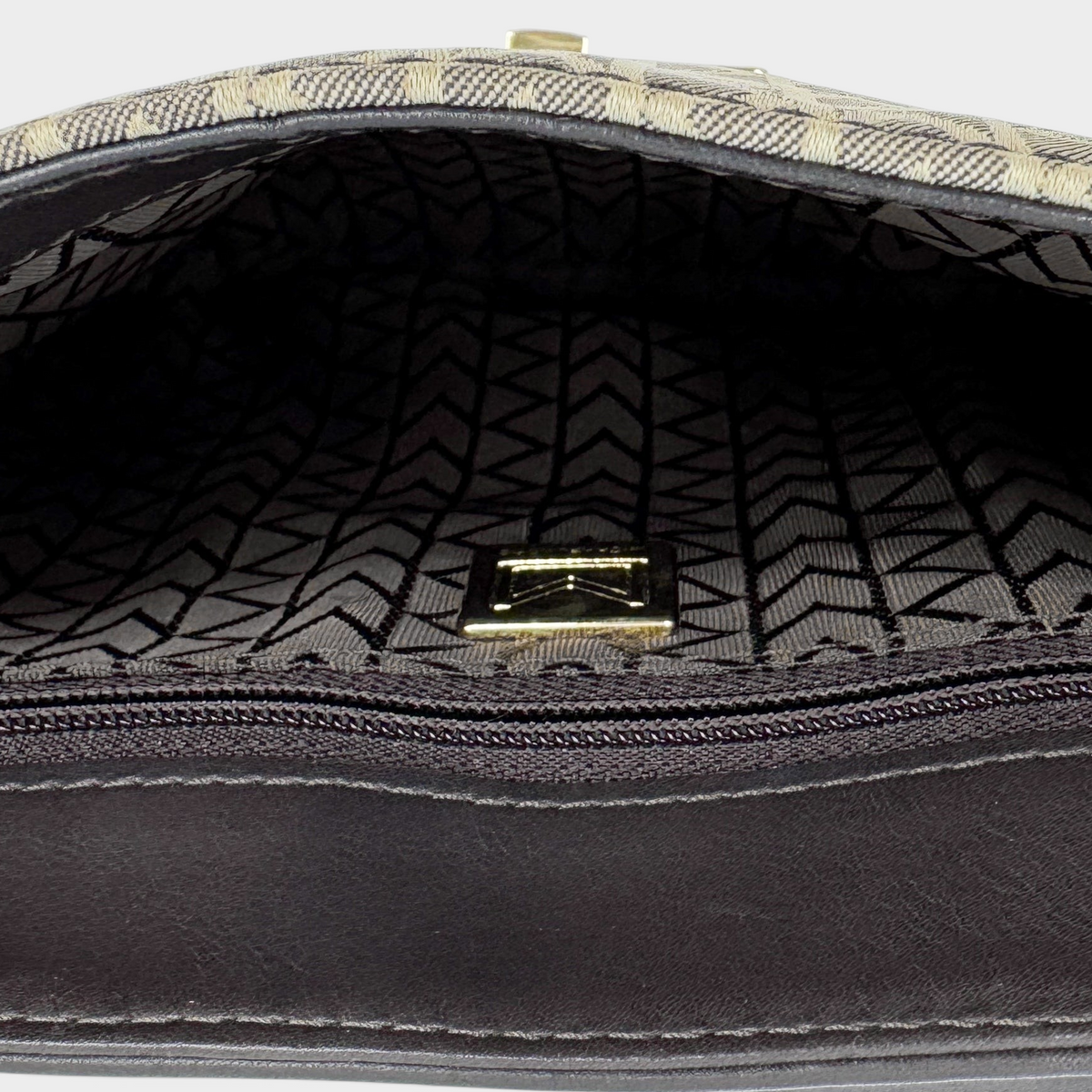 Interior of Studio61 Preloved Boutique Sydney vintage Michael Kors monogram jacquard bag with dark brown leather trim
